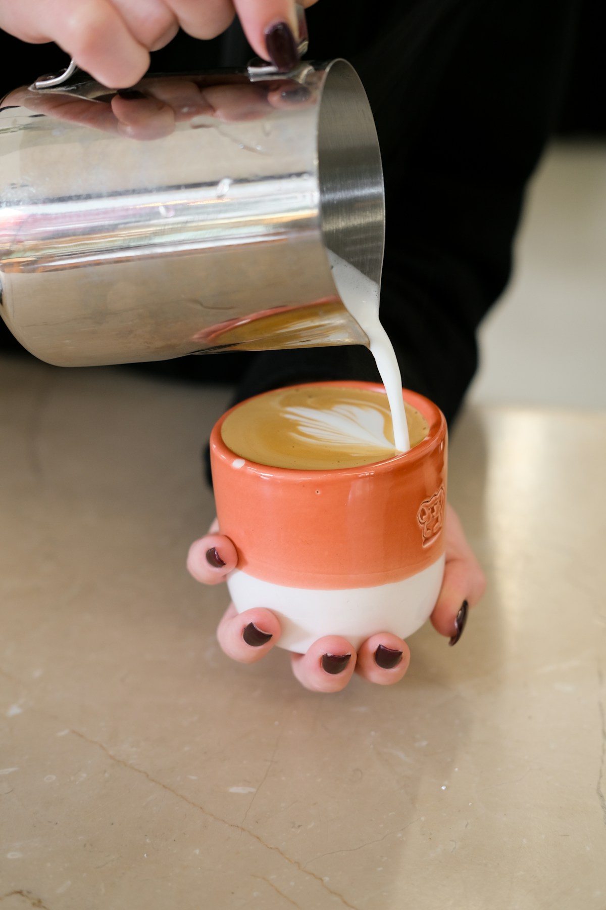 Coffee being prepared with care at the café counter